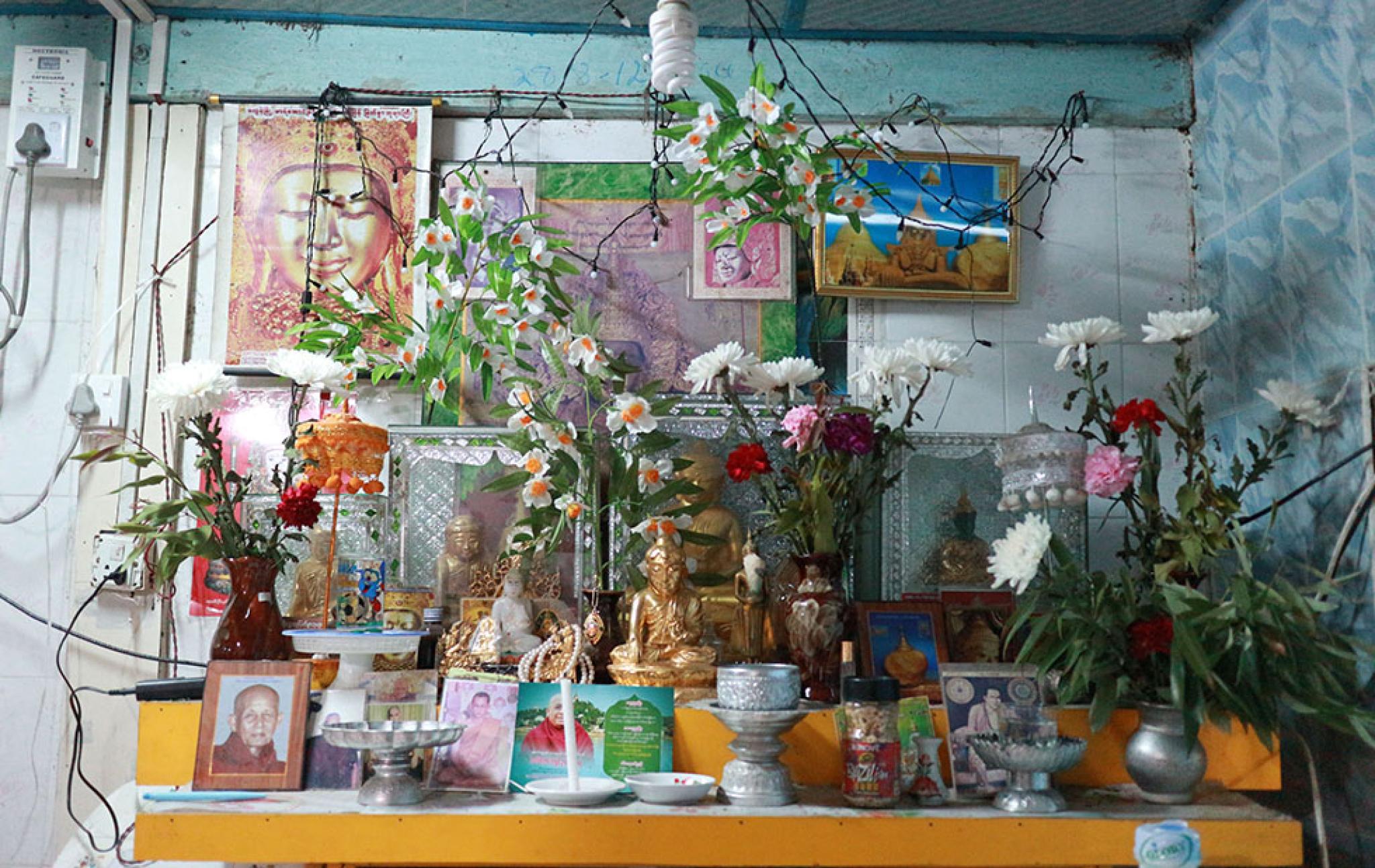 Flowers and offerings of a table in Myanmar household