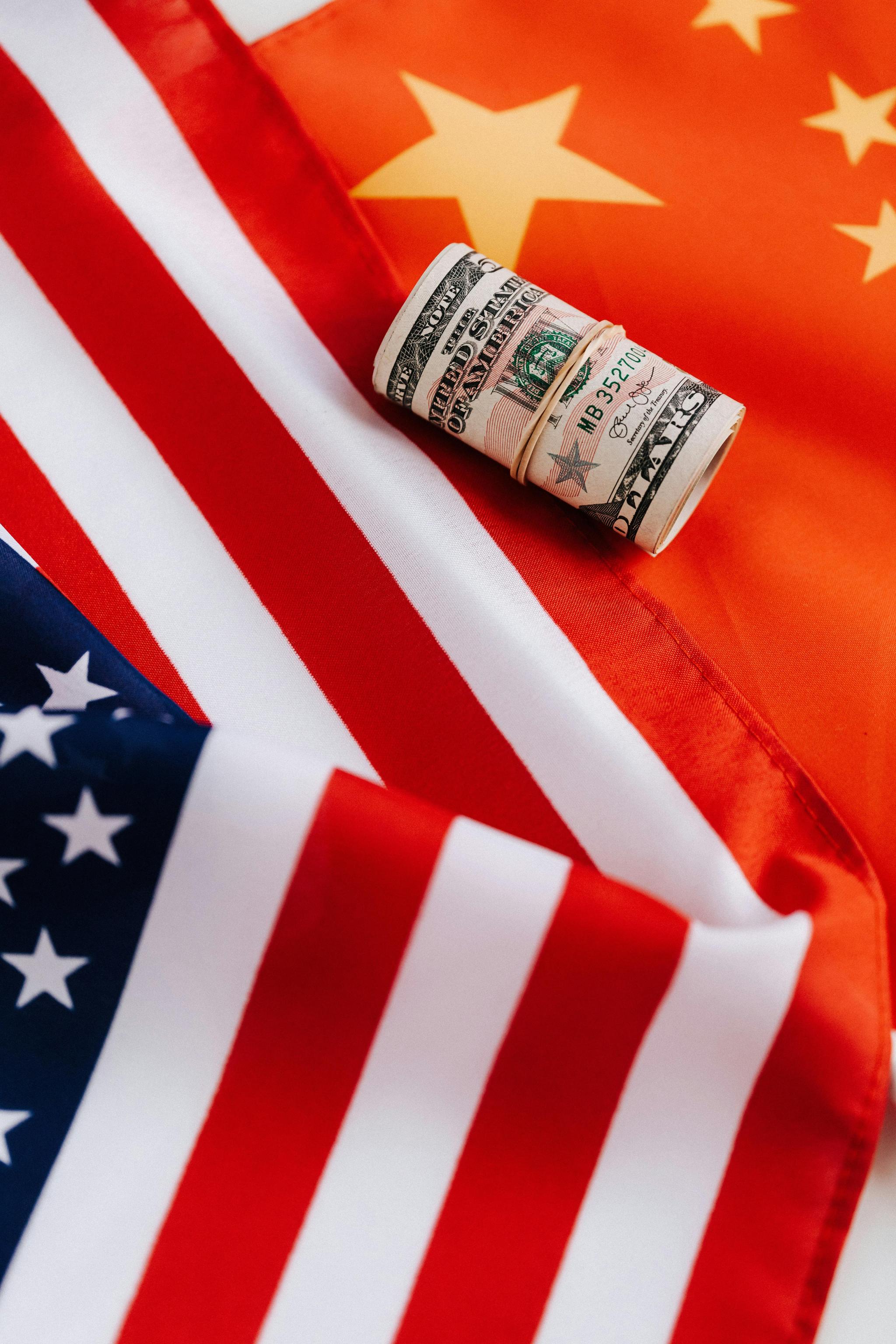 Image: Kaboompics.com from Pexels: https://www.pexels.com/photo/bright-american-flag-with-roll-of-greenbacks-4386344/