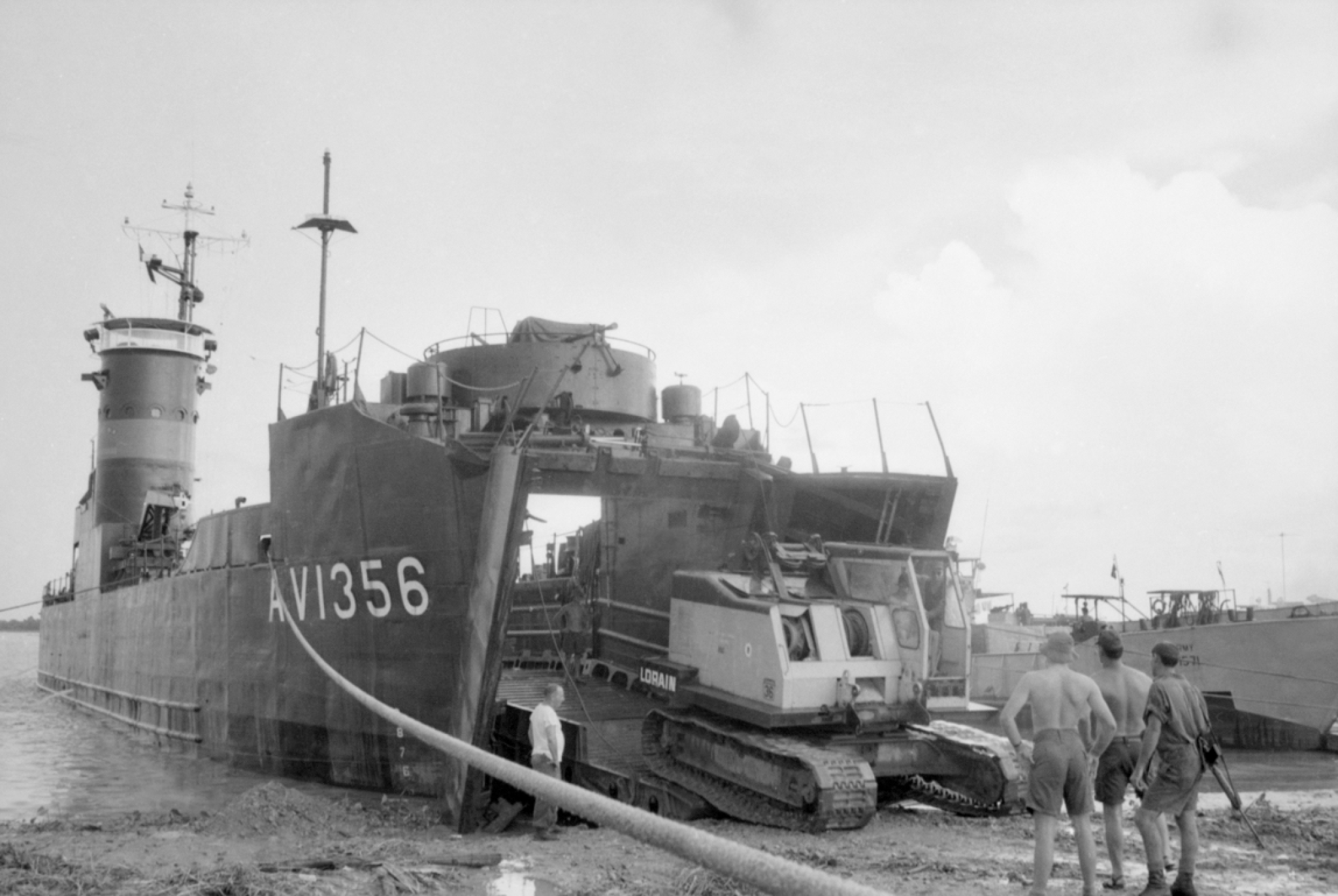Australian Army Vessel Clive Steele disgorging a mobile carne at a beach near Can Tho in the Mekong Delta, October 1969. (AWM COM/69/0729/VN)