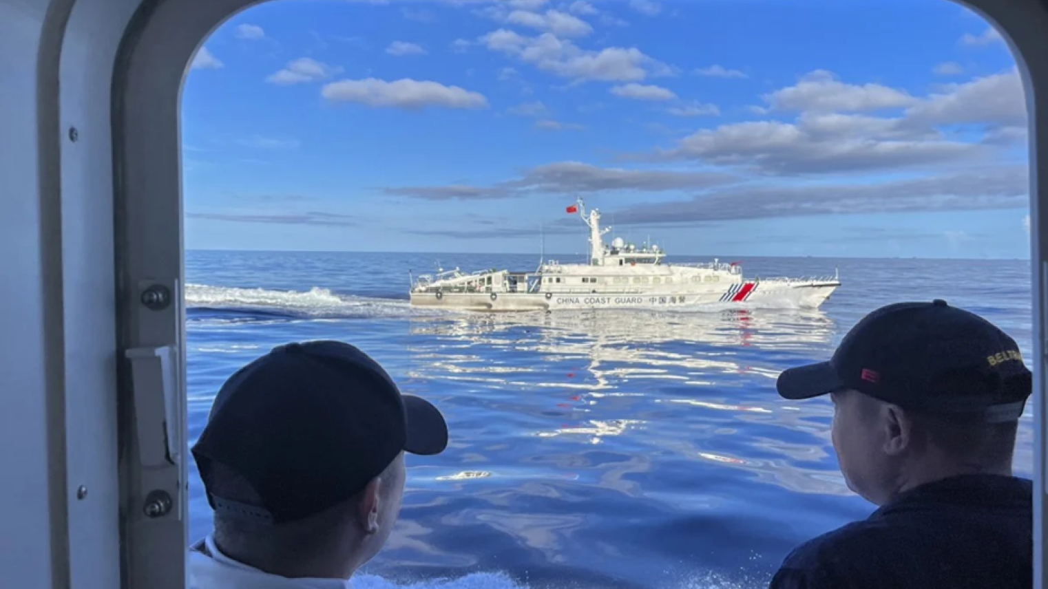 Chinese coast guard vessel manoeuvres beside the Philippine coast guard ship BRP Cabra as they approach Second Thomas Shoal during a resupply mission at the disputed South China Sea on Nov 10, 2023.