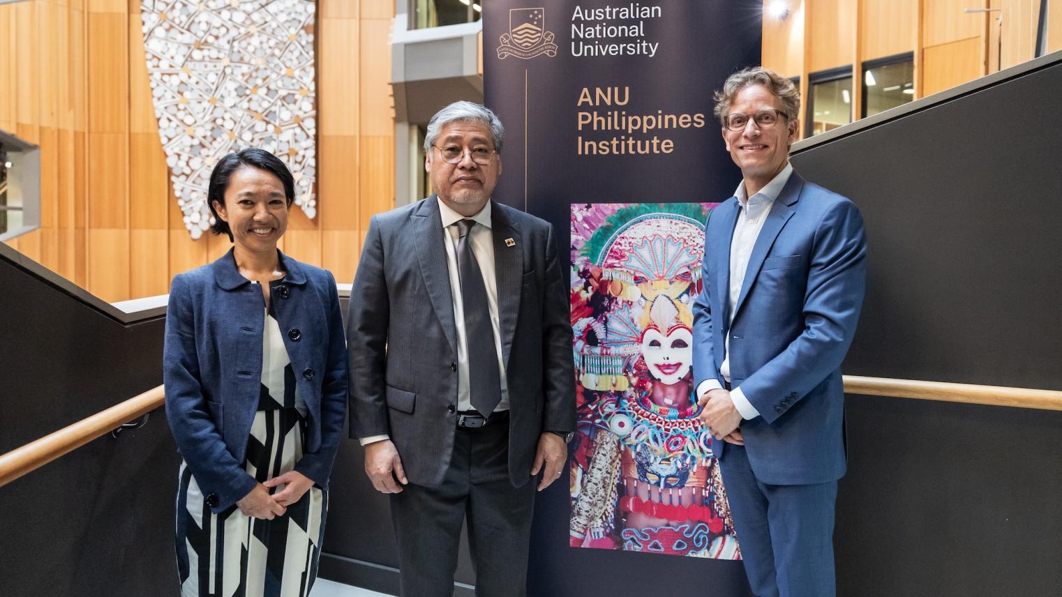 Secretary Manalo stands with ANU Philippines Institute director Björn Dressel and visiting Secretary for Southeast Asia and Global Partners in DFAT Michelle Chan.